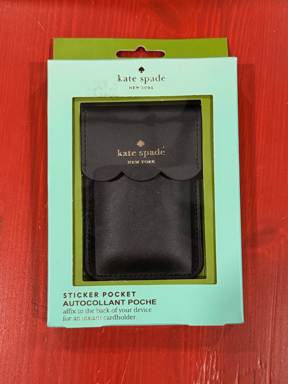 Kate Spade New York black scalloped sticker pocket for phones